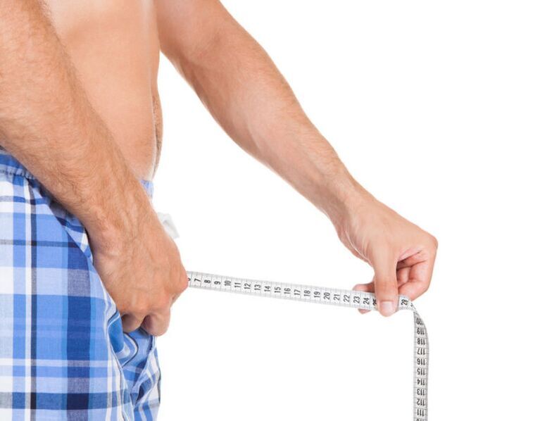 Man measures his penis with one centimeter